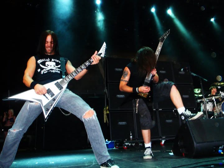 Bullet For My Valentine guitarists performing live at Mayhem Fest in Camden with the drummer behind