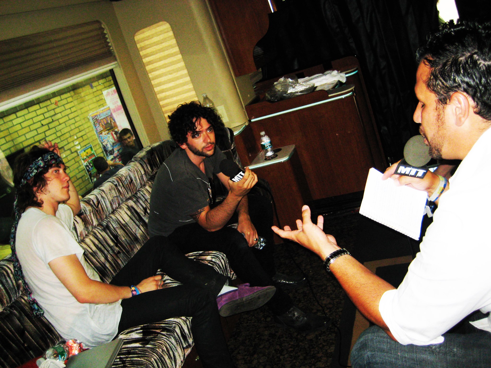Moe Train interviewing MGMT on their tour bus