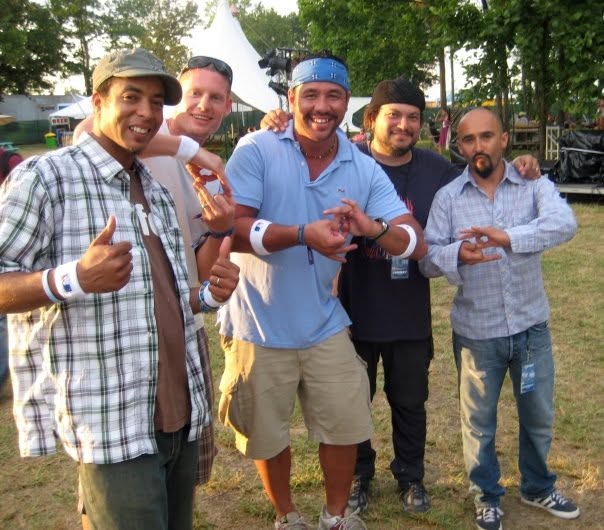 Moe Train and King B with members of Ozomatli at Bonnaroo