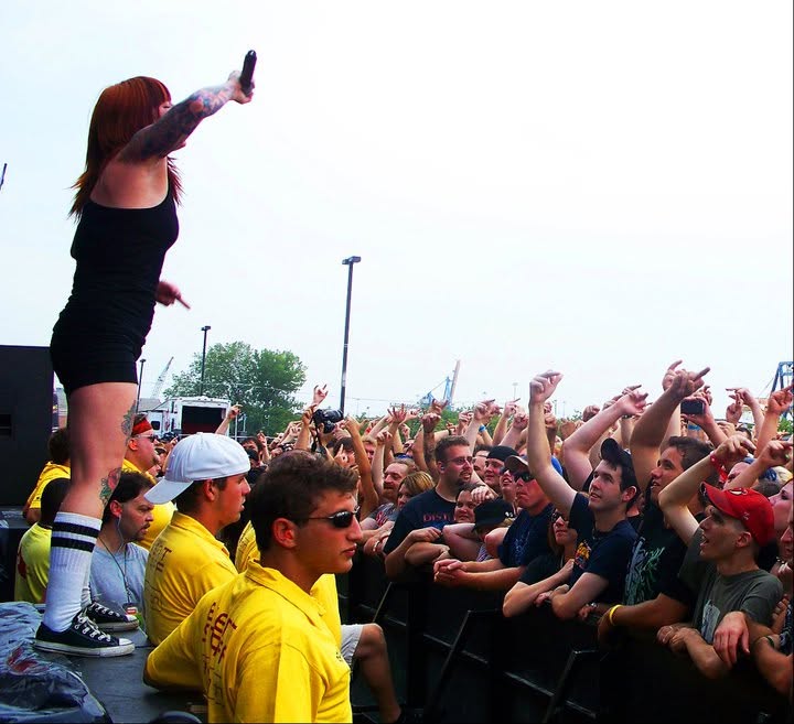 Walls of Jericho performing on the barricade in front of the crowd at Mayhem Fest in Camden