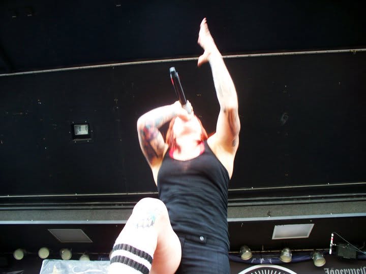 Walls of Jericho performing live at Mayhem Fest in Camden, seen from a low angle in the photo pit